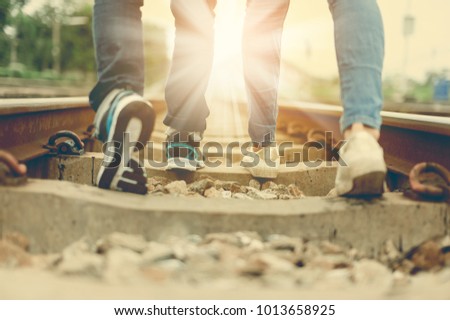 Lovers Walk Together On Railwayloving Couple Walking OutdoorWalking Forward To Destination Lovers Walk Together On Railwayloving Couple Walking OutdoorWalking Forward To Destination