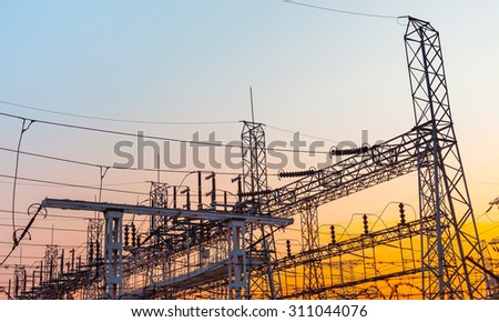 Power station. Transformer substation at sunset