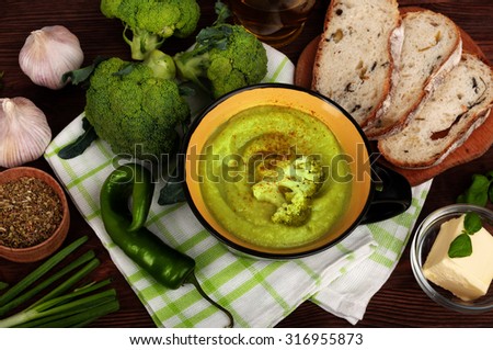 Cream of broccoli soup; dietetic foods; weight loss; juicy vegetables; cooking recipes; Cover for a cookbook; background; the substrate for the menu