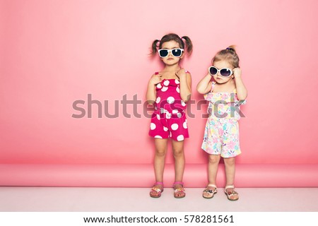 Image, Stock Photo Two little girls are fishing in ocean surf at sunset. Summer leisure, hobby and fun for kids.