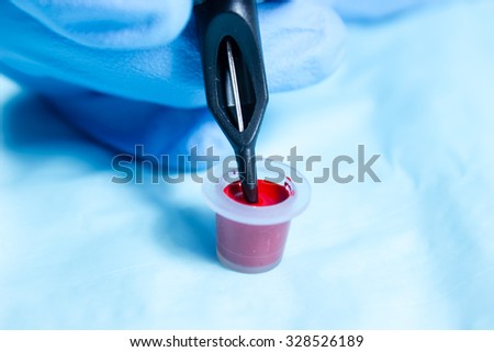 Tattoo needle and cup