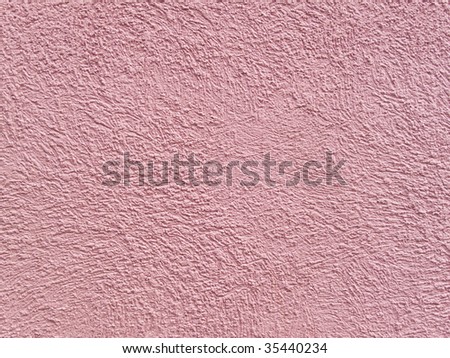 Salmon background with texture made from a stucco wall