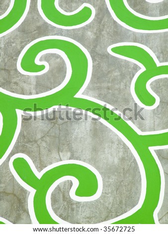 Abstract green and white design on concrete wall