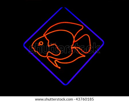 Neon sign shaped like a fish found in the window of restaurants, markets and pet stores