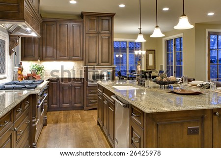 Kitchen from Butler\'s Pantry Perspective. Shows cooking island, sink, range and stone, and nook.