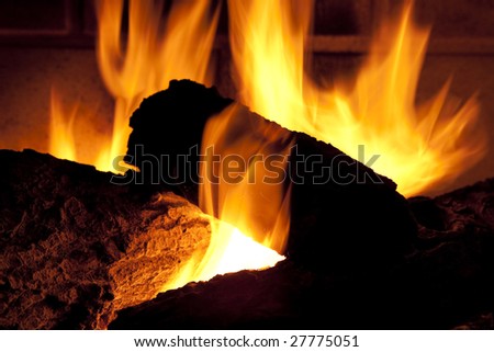 Close up of gas fireplace and logs burning.