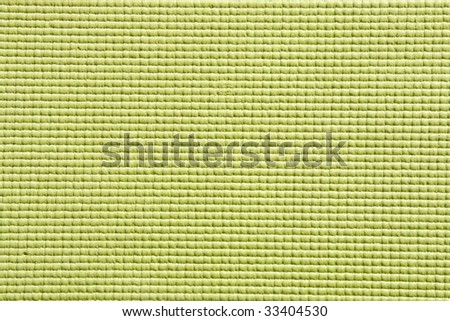 Detail view of yoga mat surface and texture in green
