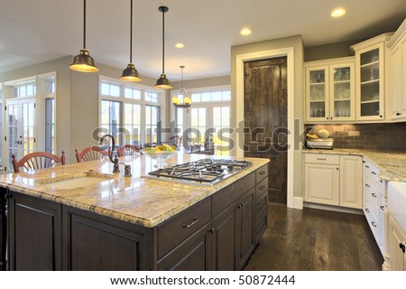 Luxury Kitchen Brightly Lit With Center Cooking Island Area Stock Photo ...