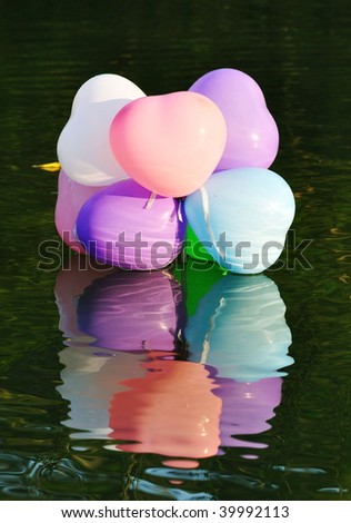 colorful balloons above the water
