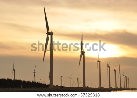 a gold sunset at the wind-power station