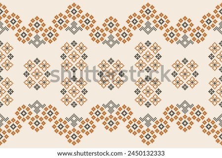 Traditional ethnic motifs ikat geometric fabric pattern cross stitch.Ikat embroidery Ethnic oriental Pixel brown cream background. Abstract,vector,illustration. Texture,scarf,decoration,wallpaper.