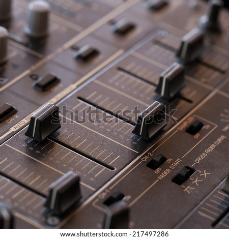 Dj sound mixer  with knobs and sliders, closeup