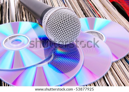 Microphone and compact disks on records, closed-up