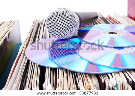 Compact disks and microphone on records, closed-up