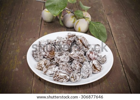 dried plum candied with sugar powder