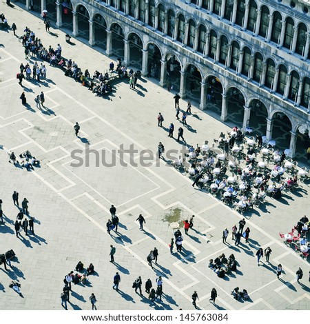 VENICE, ITALY - APRIL 12: Ambience in Piazza San Marco on April 12, 2013 in Venice, Italy. Piazza San Marco is the main landmark in the city, which receives 18 million tourists per year