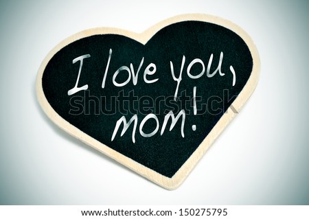 sentence I love you, mom written with chalk on a heart-shaped blackboard