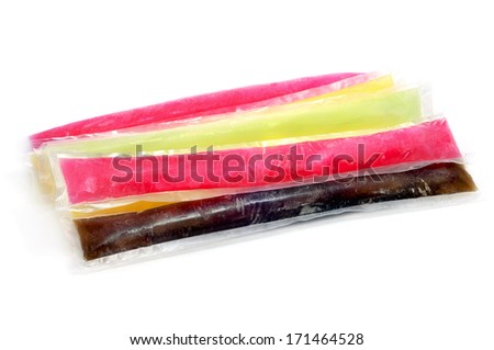 some freezies of different colors and flavors on a white background