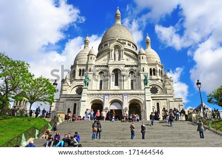PARIS, FRANCE - MAY 5: Tourist at the Sacre-Coeur Basilica on May 5, 2013 in Paris, France. The basilica is one of the most important attractions in the city, because of its panoramic view over Paris