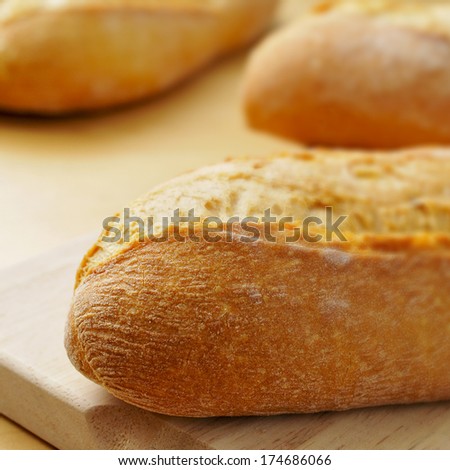 closeup of some bread rolls on a wooden surface