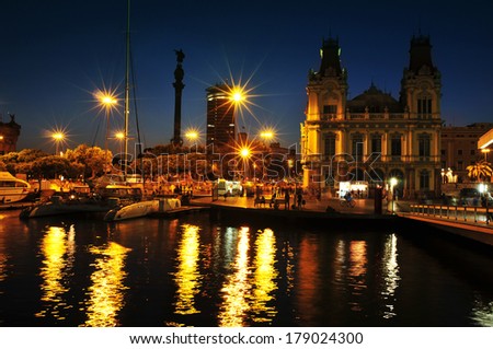 BARCELONA, SPAIN - AUGUST 20: Port Vell and Columbus Monument at night on August 20, 2013 in Barcelona, Spain. It is a 60 meters tall monument for Christopher Columbus at the lower end of La Rambla