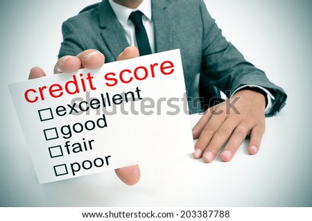 man in suit showing a signboard with the different ranges of the credit score: excellent, good, fair and poor