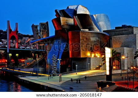 BILBAO, SPAIN - NOVEMBER 14: The Guggenheim Museum and the estuary at evening on November 14, 2012 in Bilbao, Spain. This picturesque and futuristic museum was designed by Frank Ghery