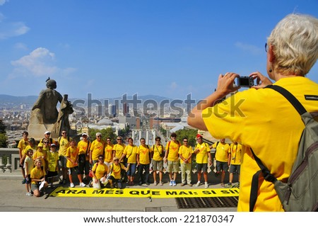 BARCELONA, SPAIN - SEPTEMBER 11: A group takes a picture before taking part in the rally demanding to vote in a referendum for the independence of Catalonia on September 11, 2014 in Barcelona, Spain
