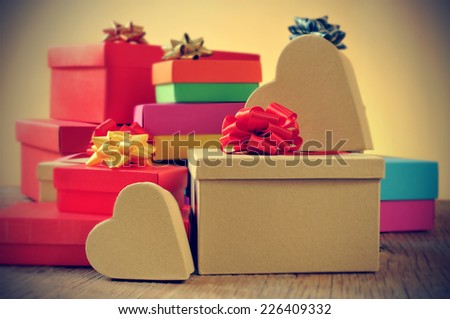 closeup of a pile of gifts in boxes of different colors, with a retro effect