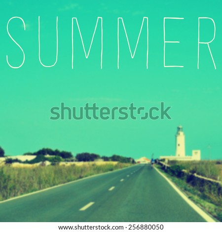 the word summer written on a blurred image of a quiet road leading to a lighthouse