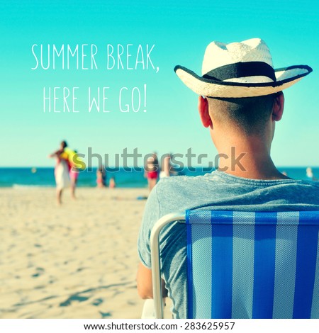 the text summer break, here we go written on a blurred image of a young caucasian man with a straw hat sitting in a deck chair on the beach