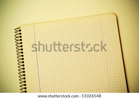closeup of an spiral notebook of quadrille ruled paper