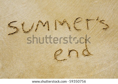 sentence summer\'s end written on the sand of a beach