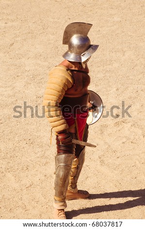 TARRAGONA, SPAIN - MAY 29: A gladiator on the arena of Tarragona's Amphitheater on May 29, 2010 in Tarragona, Spain. The show recreate a gladiators fight.
