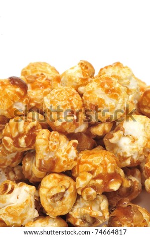 a pile of caramel corn on a white background