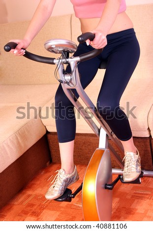 Stationary bicycle on train woman
