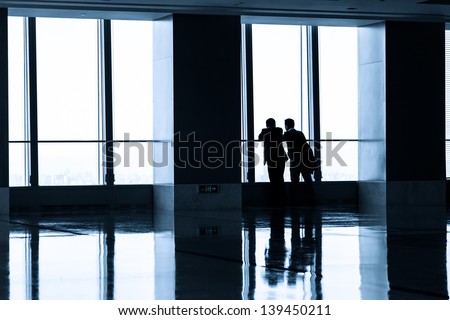 Image of People silhouettes at office building