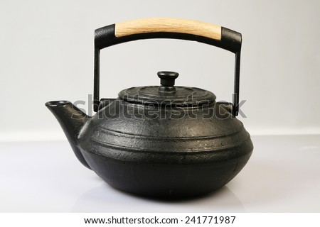 Pig-iron teapot it is isolated on a white background