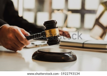Attorneys or judges use the president's gavel to judge justice matters at law firms, legal concepts and legal services.