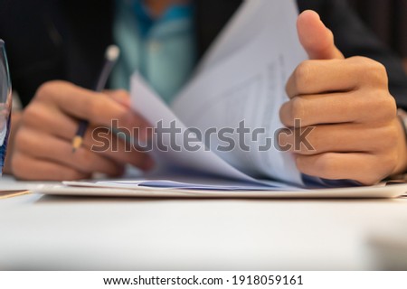 Start up learning for Document report business note in meeting room concept: Businessman manager hands writing for reading, signing in paperwork or documentation files at corporate on office desk 商業照片 © 