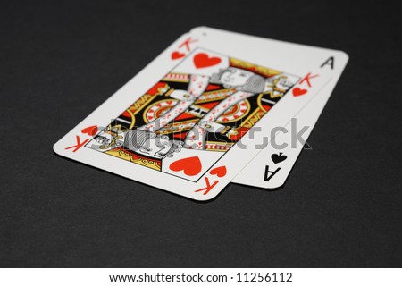 Closeup of two playing cards: king and ace. Shallow focus depth on front sides of cards