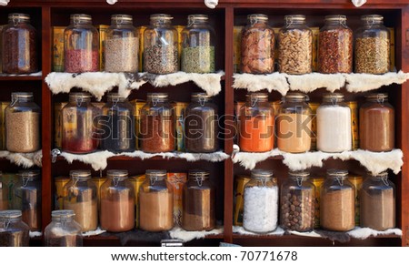 Natural food items and medical herbs in glass containers - asian marketplace