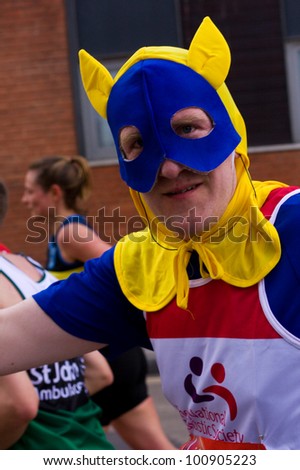 LONDON - APRIL 22: Unidentified man runs the London marathon on April 22, 2012 in London, England, UK. The marathon is an annual event.