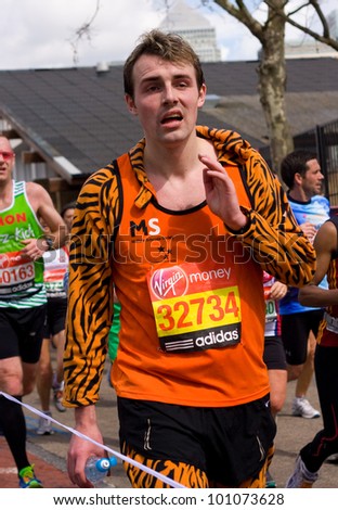 LONDON - APRIL 22: Unidentified man run the London marathon on April 22, 2012 in London, England, UK. The marathon is an annual event.