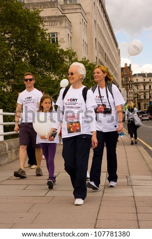 LONDON - JULY 15: Unidentified people walk the London CRY walk on July 15, 2012 in London, England, UK. The CRY Heart of London Bridges Walk an annual event.