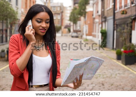 woman on the phone holding a map
