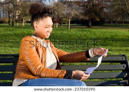 young woman reading a letter