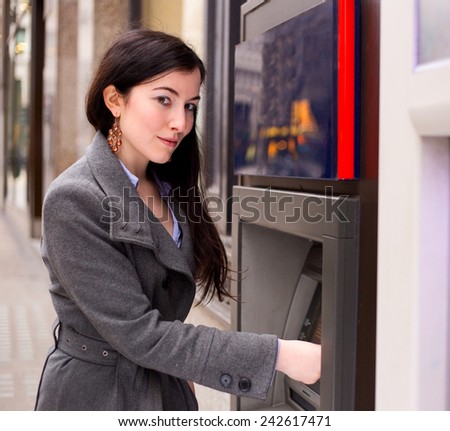 young woman at the cash machine