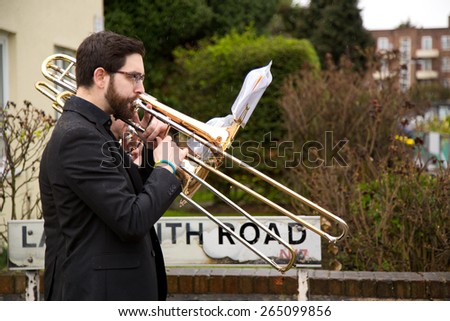 LONDON - MARCH 29TH: Unidentified musician at a palm sunday procession on March the 29th, 2015, in London, England, UK. Palm sunday is an annual religious celebration.