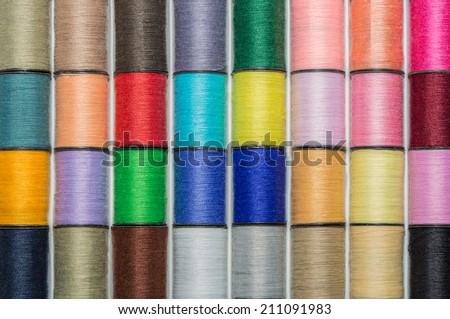 colored spools of cotton thread